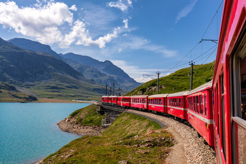 Rhaetian Railway, Bernina Express at Lago Bianco lake, Bernina Pass, Pontresina, Canton of Graubünden, Switzerland