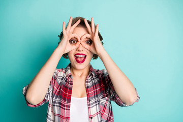 Close up photo of crazy funny teen girl make binoculars watch spy fellows scream enjoy rejoice...