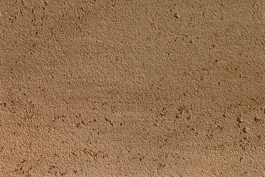 beautiful grunge orange stone like stucco texture for background use.