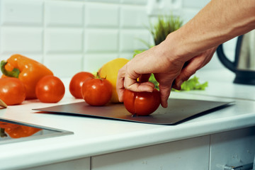 woman cutting vegetables in the kitchen