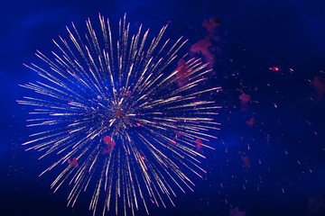 Inexpensive fireworks, over the city, red and blue. Celebration conept, Motion blur, For any purpose