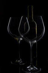  glass of red and pink wine on a black background. Wine list menu. Close up of the power of glasses and bottles in low key