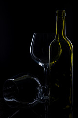  glass of red and pink wine on a black background. Wine list menu. Close up of the power of glasses and bottles in low key