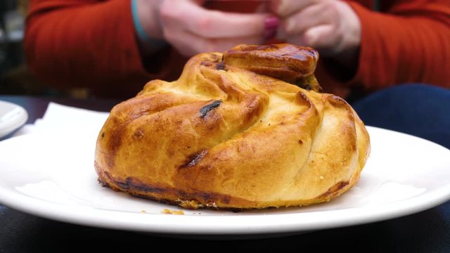 Preparing to eat a tasty Qassatat, otherwise known as a Pastizz, in Malta