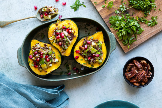 Acorn squash stuffed with quinoa, nuts and vegetables