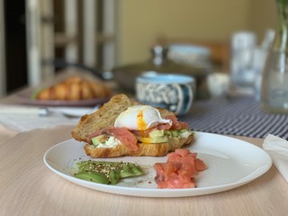 Croissant with salmon and poached egg