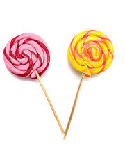 Lollipops isolated on a white background. Set of pink candy and yellow candy. Big caramels.