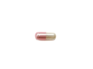 Tablet isolated on a white background. Medical capsule. Pink pill.