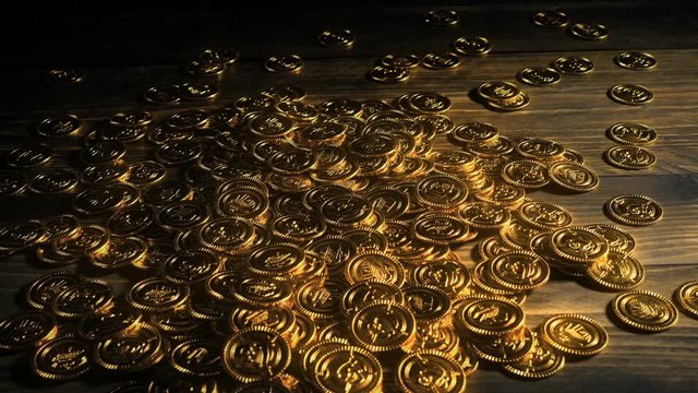 Glowing Gold Coins Pour Onto Table