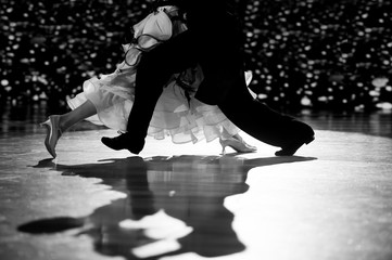 Woman and man dancer latino international dancing.Black and white filter