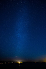 The Milky Way stretches over Puget Sound at night