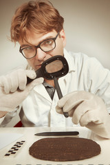 Scientist in museum office working on cuneiform find