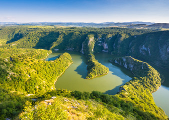 Green gorge in canyon of Uvac river in Serbia with sunset light