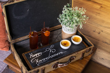 Breakfast tray in bed in hotel room. honey moon box set