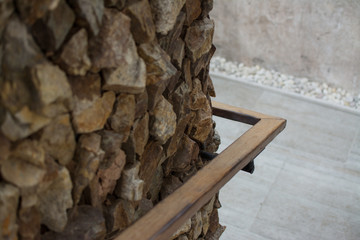wood handrail with stone wall