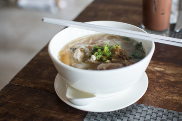 thai chicken noodles  on table