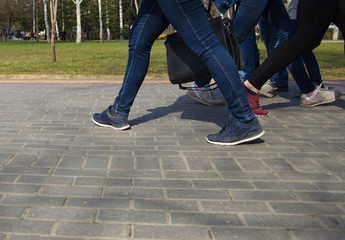 Fototapeta premium walking on city streets with shoes and athletic shoes