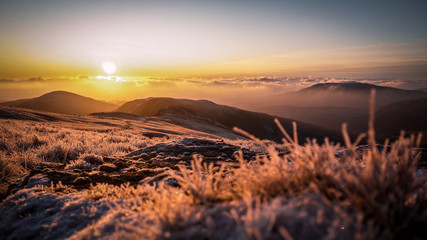Sunrise on frozen mountains of Snowdonia National Park, Wales, UK