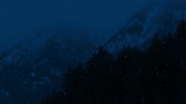 Snow Falls In Mountain Wilderness At Night