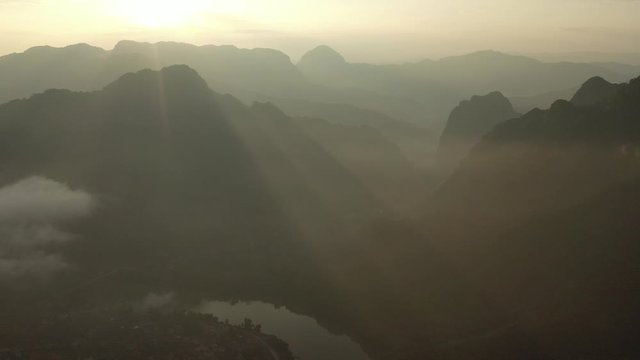 Aerial view of mountains and river Nong Khiaw. North Laos. Southeast Asia. Photo made by drone from above. Bird eye view.