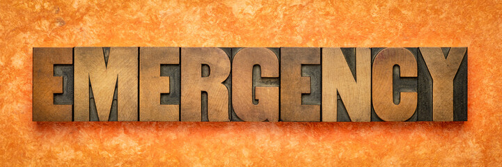 emergency word banner in wood type