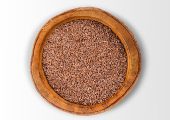 Wooden bowl of light raw natural organic linseed flax-seed on white background.