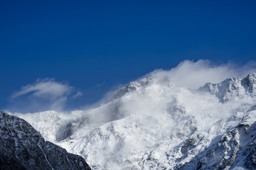 Close up shot of Mount Cook's peak cover by snow in winday sunny day.Mount Cook located in Hooker Valler,New Zealand.