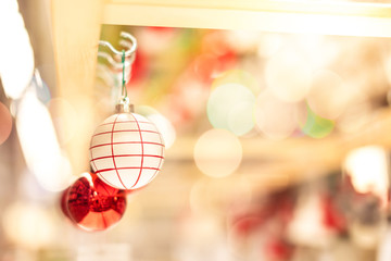 White and red pattern Christmas ball ornament hanging on hook for sell, Merry Christmas and Happy New Year