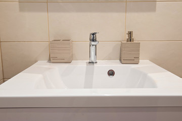 Bathroom interior with sink and faucet