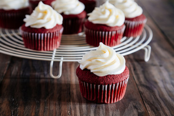 Red velvet cupcakes on a rustic wooden table