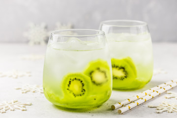 Iced kiwi cocktail in glasses. Selective focus, space for text.