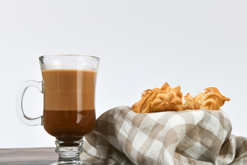ocoa with cookies on a white background. A cup of delicious hot cocoa and cookies.