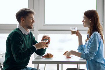 couple having breakfast in the kitchen