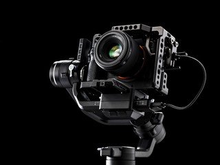 Professional digital camera on black background