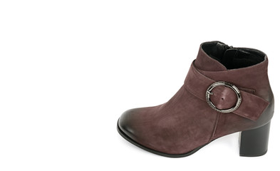 Stylish suede ankle boot isolated on white background. City lifestyle. Female fashion. Free space for text.