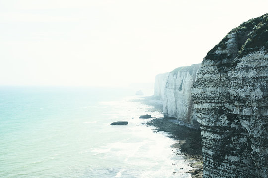 Misty view of the rocky seashore of Normandy