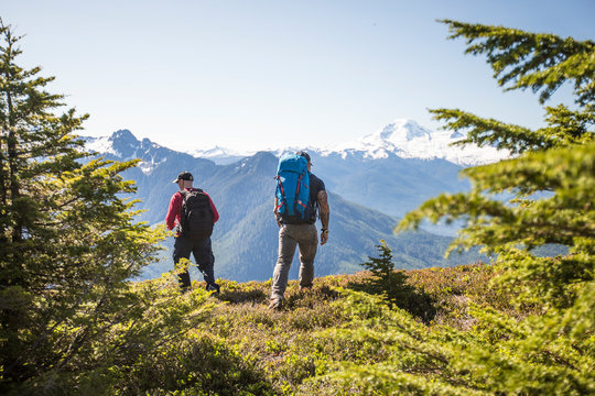 Two backpackers hiking on Bald Mountain, Washington.