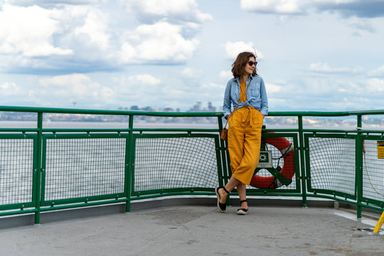 Stylish woman is enjoying the ride aboard Washington ferry in Seattle