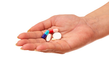 Woman hand with a pills