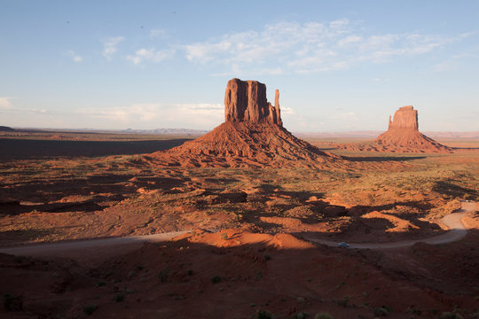 Clouds shade the iconic rock formations in Monument Valley, AZ