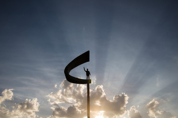Juscelino Kubistchek Memorial and his statue during sunset