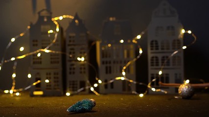 Symbol of ending 2020. Pretty domestic rat leaves the frame and drops the Christmas tree. Close-up of a grey rat in festively decorated dark room with bright lights. Shooting in slow motion.