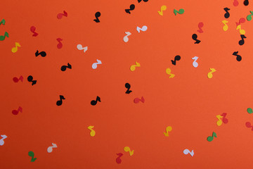 Paper colorful music notes background. View above
