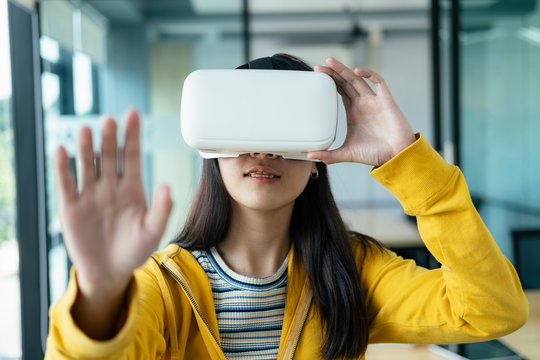 Young programmer with virtual reality glasses to testing 3D appl