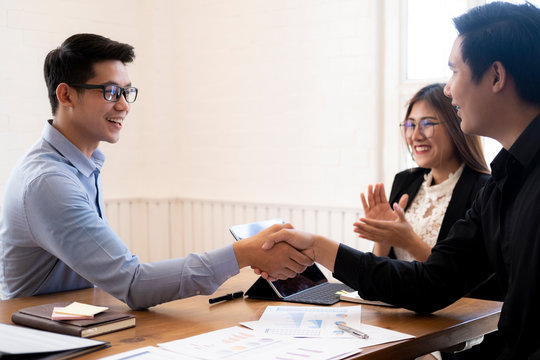 Businessmans handshake after good deal.