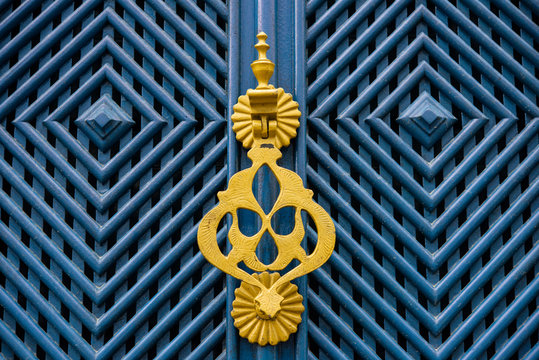 Colonial blue door with yellow door knocker