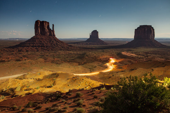 Vehicle lights captured through a long exposure at Monument Valley, AZ