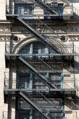 Wall of the house with fire stairs in downtown New York