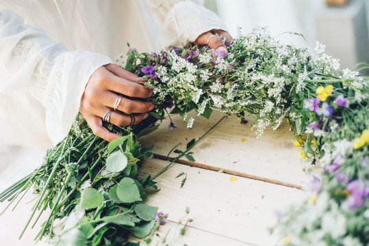 Woman preparing flower wreath