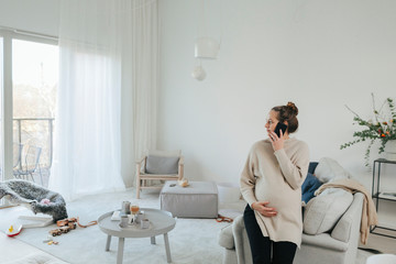 Pregnant woman using cell phone